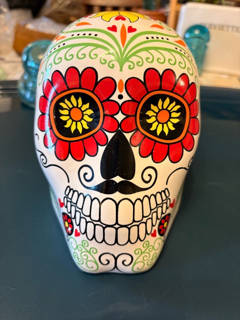 Day of the Dead Ceramic Skull - White and Red. 5 in high. 5 in. Wide.
